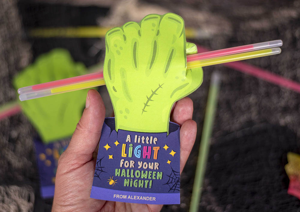 halloween glow stick holders in the shape of a zombie hand
